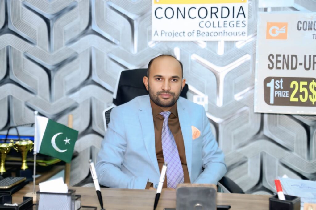 Managing Director Concordia standing in front of the Concordia campus building highlighting leadership and institutional development.